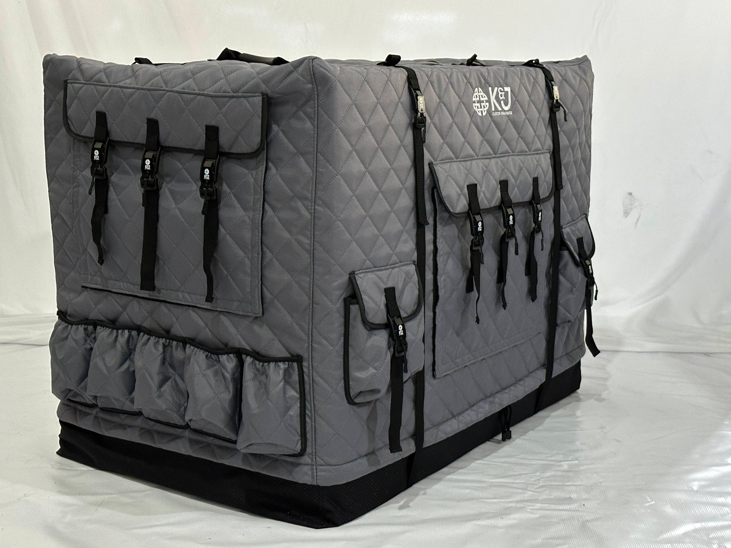  A grey insulated crate dog cover with storage pockets